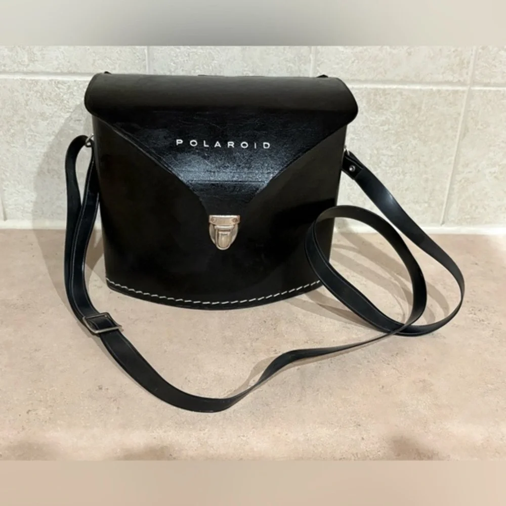 Vintage Polaroid Swinger camera and case